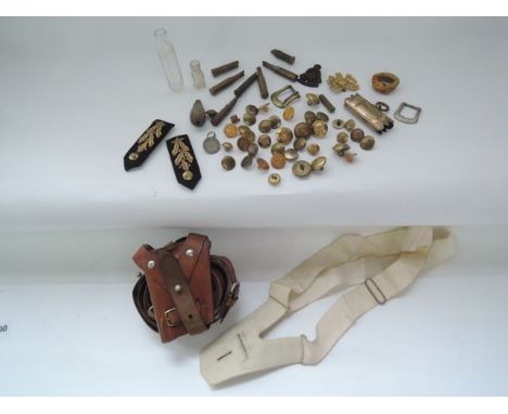 Two military belts, military badges, scabbard mounts, etc