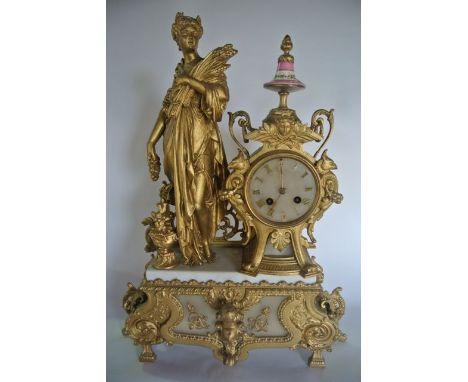 A substantial 19th century gilded spelter mantle clock in the classical style, the movement with alabster dial surmounted by 