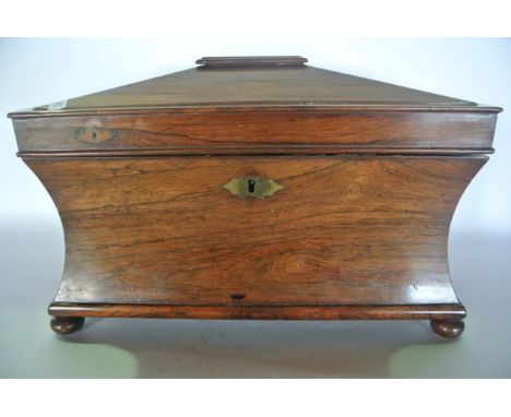 A good quality 19th century rosewood veneered sarcophagus shaped tea caddy with hinged lid revealing a divisional interior of