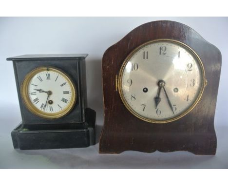 A simple Victorian black slate mantle clock with 8 day timepiece and a later mahogany mantle clock with 8 day striking moveme