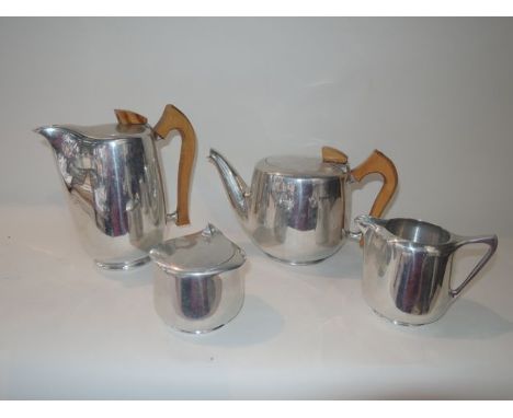 A four piece vintage Picquot ware drinks set comprising teapot, hot water pot, lidded sugar basin and milk jug