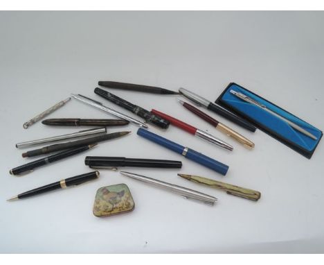 A collection of vintage roller ball and fountain pens