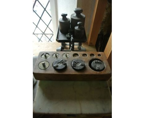 A Victorian cast iron framed domestic scale set with heavily embossed shell and cherub detail, stamped 5kg complete with nume