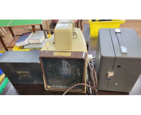 An opticron Polarex II pair of binoculars, boxed, a Kodak Instamatic movie projector, and a Kodaslide table projector. (3)