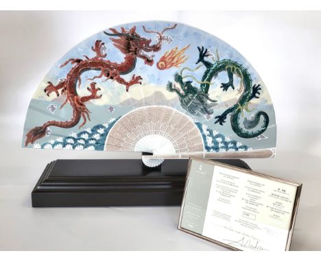 A limited edition Lladro fan 8128 with base and certificate in original box. 28cm x 54cm including original box.Presented in 