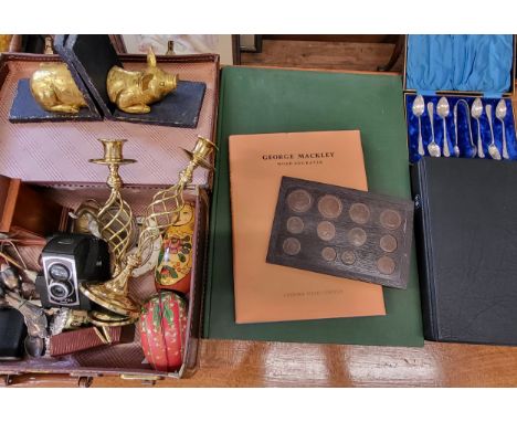 An eclectic mix including pig bookends, two hip flasks, two gold coloured candlesticks, two elephant (brass/pewter), a ross e