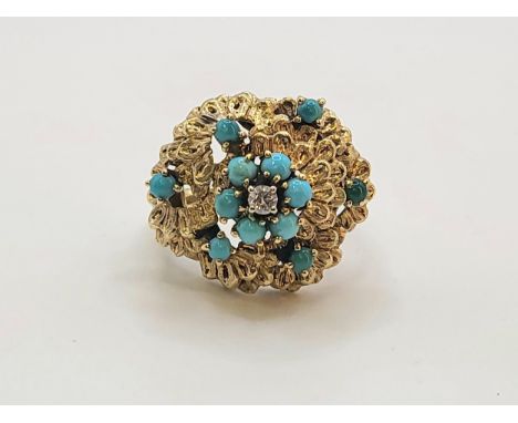 An 18ct stamped yellow gold turquoise and centrally set diamond ring. 8.9gms size K 1/2.