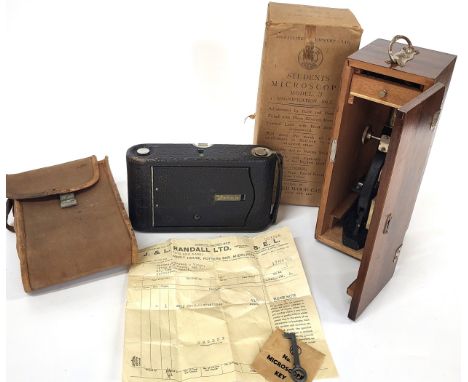 A vintage Kodak camera in original case, and a vintage Student's Microscope Model 3 in original box and packaging, lockable c