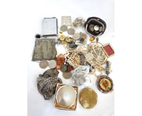 A bag of costume jewellery including a hard stone orange necklace, multiple sets of faux pearls, and miscellaneous collectabl
