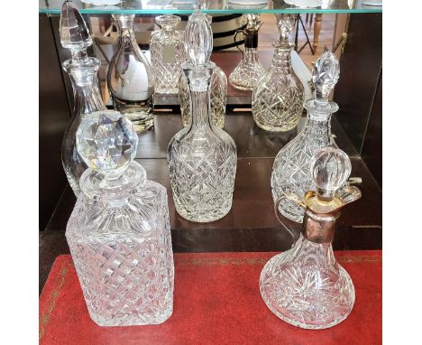 Four cut glass decanters with stoppers and a carafe with stopper. (5)