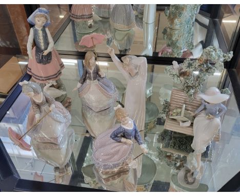 Six Lladro figures of young ladies, one seated on a bench with dove. (6)No visible damage, all parasols present.