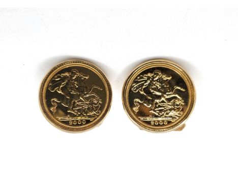 A pair of half sovereigns set in 9ct yellow gold cufflinks for the year 2000. (in mint condition). 14.1gms