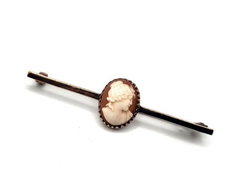 A cameo portrait of a woman in 9ct yellow gold tie pin. 3.4gms