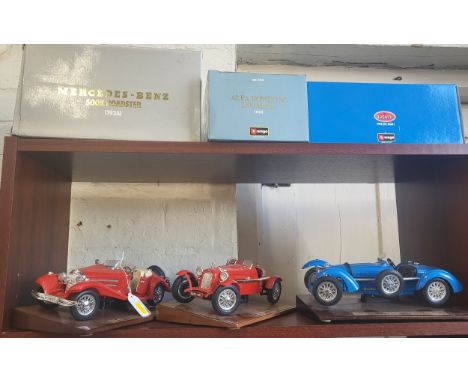 Three Burago 1930's sports cars including Mercedes-Benz, Bugatti, and Alfa-Romeo in boxes. (3)