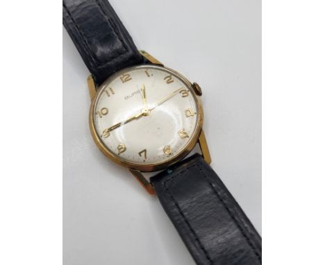 A vintage 9ct yellow gold Buren 1950's gentleman's watch , inscribed with a long service award on a leather strap.