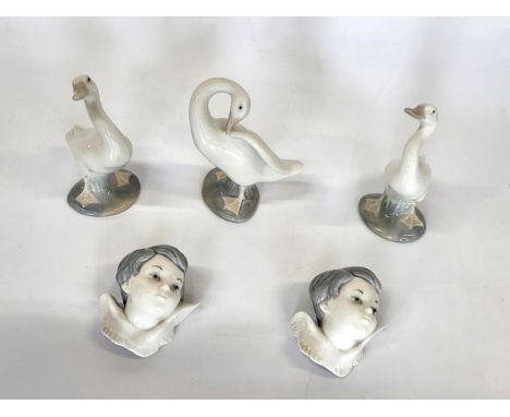 Three Lladro geese and two angel's heads. (5)