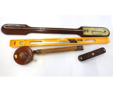 A barometer and a collection of vintage toolsApprox 15% mercury left in the glass tube.