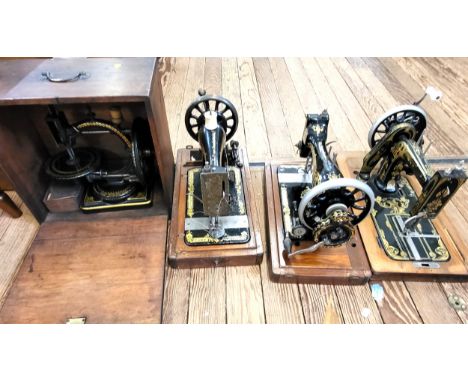 Four vintage/antique sewing machines in cases,  including two Singer, a Stoewer, and a Nussey &amp; Pilling. (4)