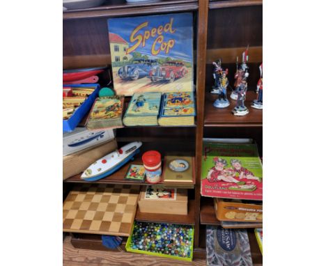 Sutcliffe clockwork tinplate blue and white Bluebird spped boat in original box, Louis Marx clockwork Speed Cop Set (lacks Po