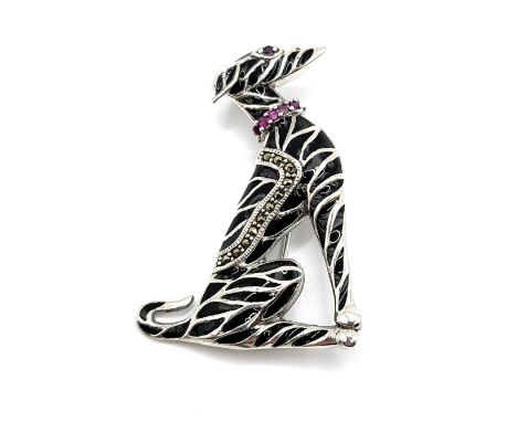 A silver and black enamel plique du jour greyhound/ whippet brooch/ pendant with a collar of rubies. 5cm x 3.5cm. 9.8gms.