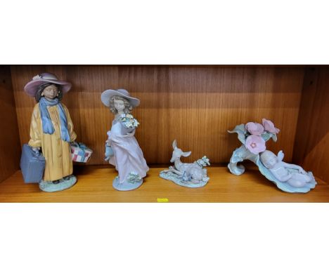 Four Lladro figures in original boxes including 5673, 7676, 1567, and 6786. (4)