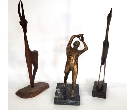 An Art Deco bronze male nude sculpture of a discus thrower, 23cm, and two mid-century wooden ornaments.