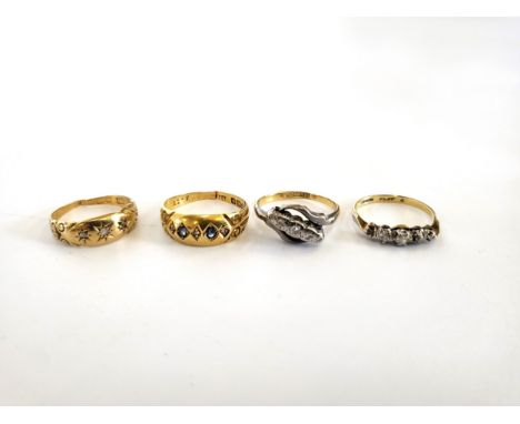 An 18ct yellow gold with platinum crown ring set with five diamonds in a cross over style 2.4gms size K, an 18ct yellow gold 
