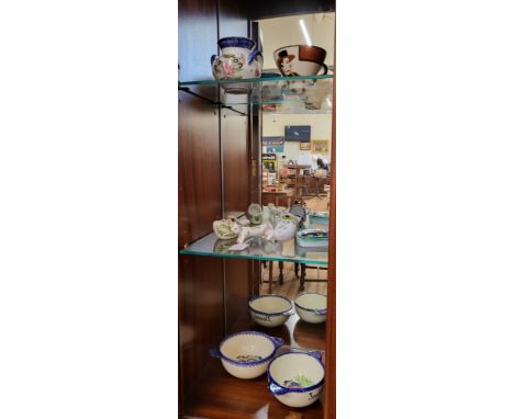 A collection of French Faience Quimper pottery comprising bowls, shoes, box, etc. (8)