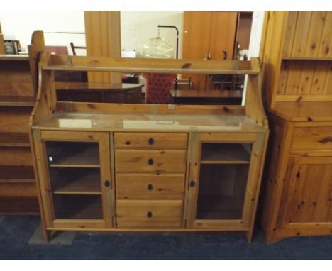 A Pine Side Board with Four Centre Drawers and Raised Display Shelf, 142cm Wide