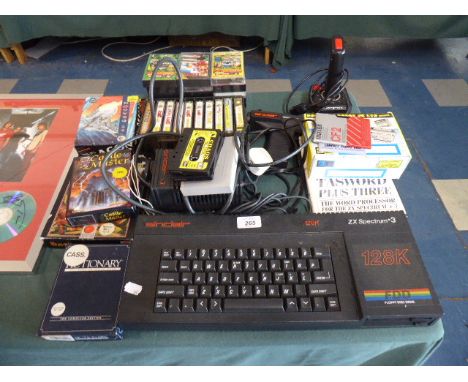 A Vintage ZX Spectrum + 3 Together with Collection of Games, Expansion Slot, Joy Stick, Light Gun Etc