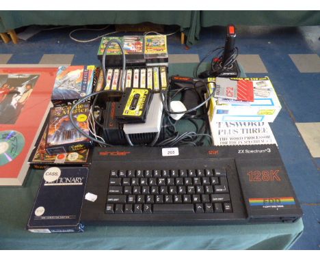 A Vintage ZX Spectrum + 3 Together with Collection of Games, Expansion Slot, Joy Stick, Light Gun Etc