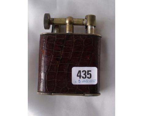 Large skin covered lighter with brass mounts    