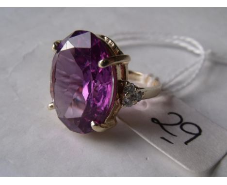 Amethyst oval gold mounted ring set with diamond  shoulders 6.4g 'K'        