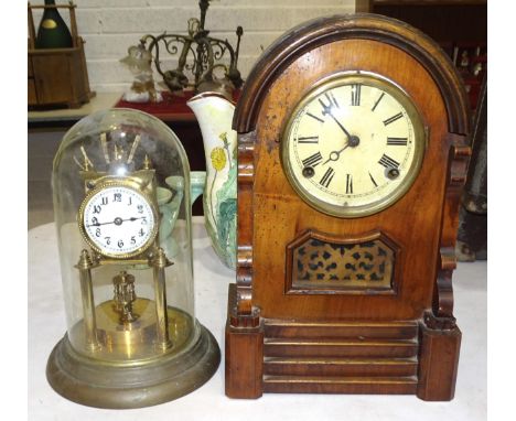 A wood case striking mantel clock by the Teutonic Clock Manufactory, 38cm high and brass 400-day clock under glass dome, 29cm