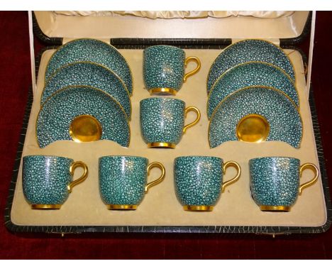 A set of six each Royal Worcester coffee cups and saucers in the green shagreen pattern, in fitted case, (one saucer damaged)