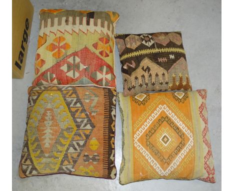 Four Turkish 'carpet' cushions, other cushions and textiles.