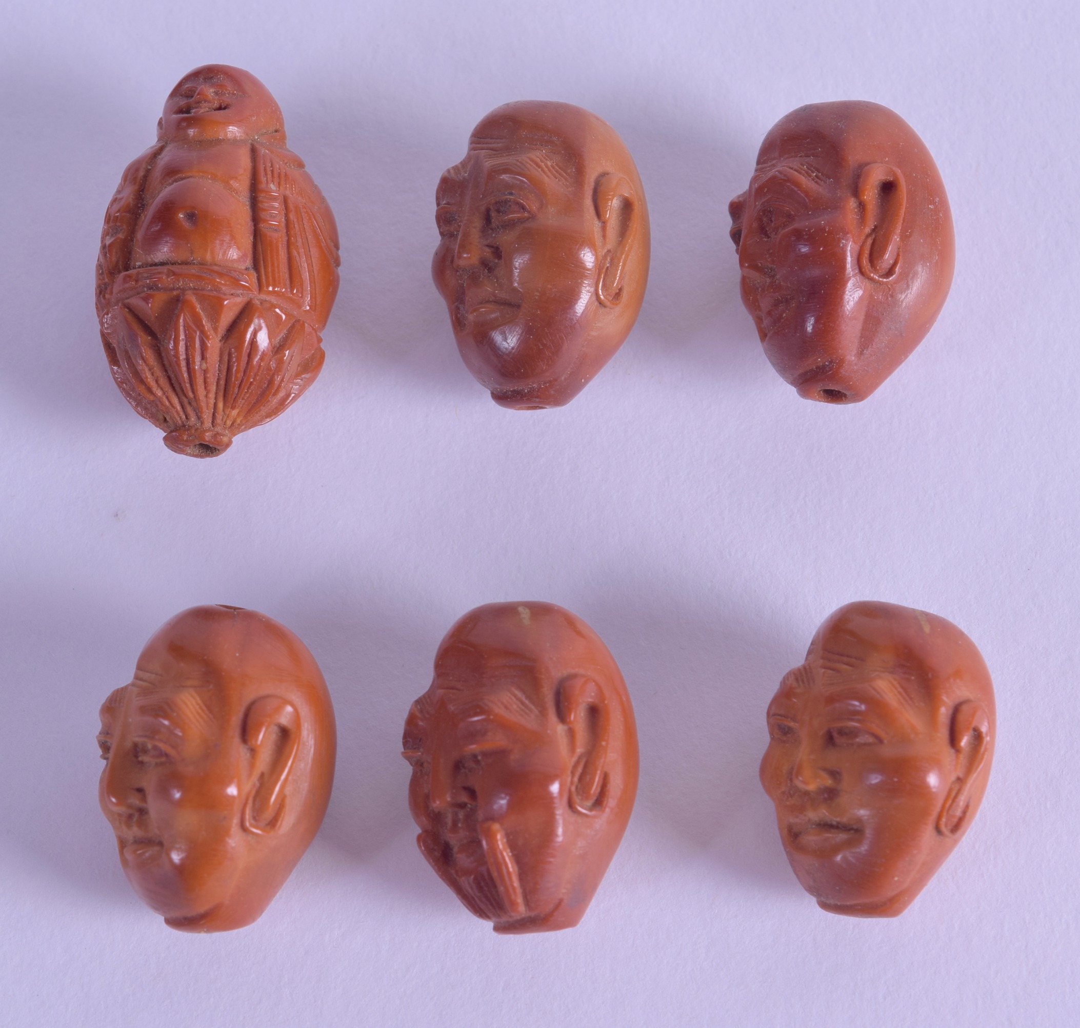 A GROUP OF SIX EARLY 20TH CENTURY CHINESE CARVED NUTS in the form of ...