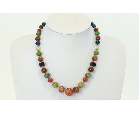 A Vintage Semi Precious Multi Stone Necklace Short collar length necklace strung with multiple semi precious beads of varying