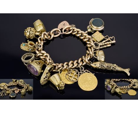 An Impressive Vintage 9ct Gold Albert Chain & Padlock Loaded with 12 9ct Gold Charms and a South African One Pound 22ct Gold 