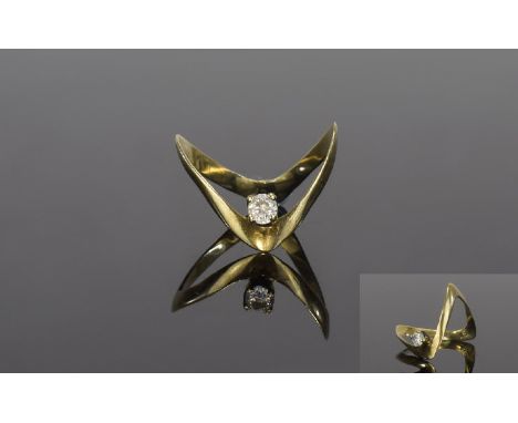 9Ct Gold Wishbone Shaped Ring with central round cut diamond set  the diamond is of good colour and clarity est diamond weigh