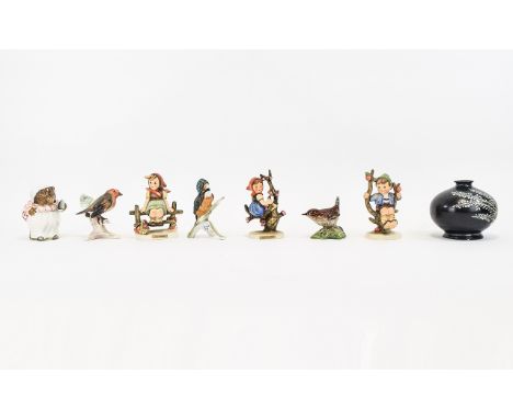 A Small Collection Of Ceramic Figures Eight in total to include three small Hummel figures, Beswick Beatrix Potter Mrs Tiggyw