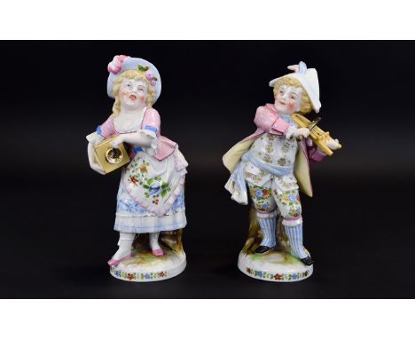 Conta and Boehme Pair of Child Musician Matchbox Holder Figures, both boy and girl dressed in a pastiche of adult late 18th c