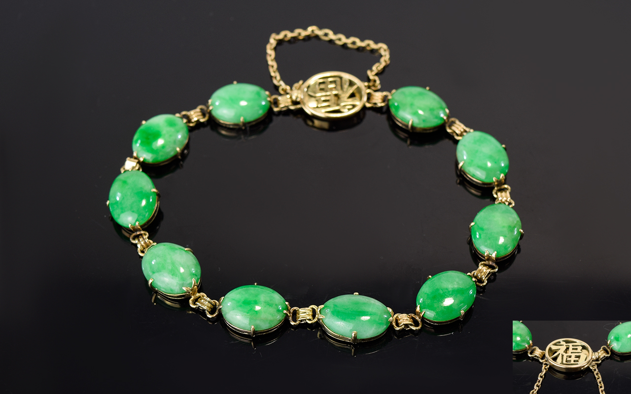 Jade Tennis Bracelet, oval cabochons of mottled green jade set in 14ct