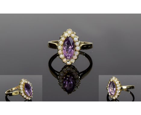 Ladies 9ct Gold Amethyst and Opal Dress Ring. The Marquise Cut Amethyst Surrounded by Opals. Fully Hallmarked for 9ct. 3 gram