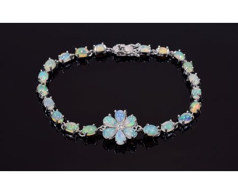 Opal Flower Centred Line Bracelet, the bracelet set with oval cut cabochon opals and the flower with pear cut cabochon opals 