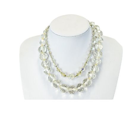 A Pair Of Vintage Faceted Crystal Necklaces Two in total, the first comprising clear circular faceted glass graduated beads. 
