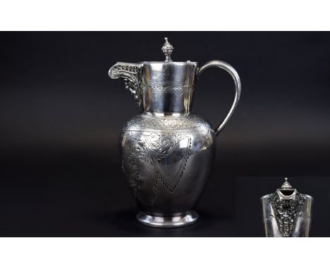 A Silver Plated Water Jug/Carafe Late 19th Century water vessel in neoclassical style with floral and foliate etching and dec