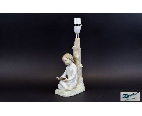 Lladro Lamp Base A charming lamp base in the form of a young girl in nightdress reading a book leaning against a tree. Good c