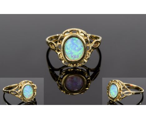 Ladies 10ct Yellow Gold Opal Set Dress Ring with Open work Bezel and Shoulders. Marked 10ct. Ring Size R-S. As New Condition.