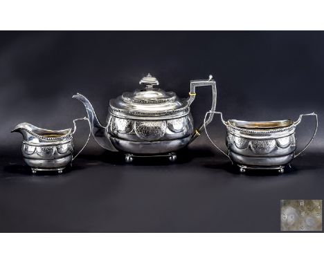 George III Three Piece Silver Tea Service Makers Mark For Duncan Urquhart and Naphtali Hart London 1811, of oval form, with b